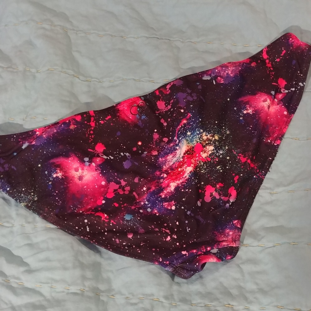Op vibrant cosmic print bikini bottoms.